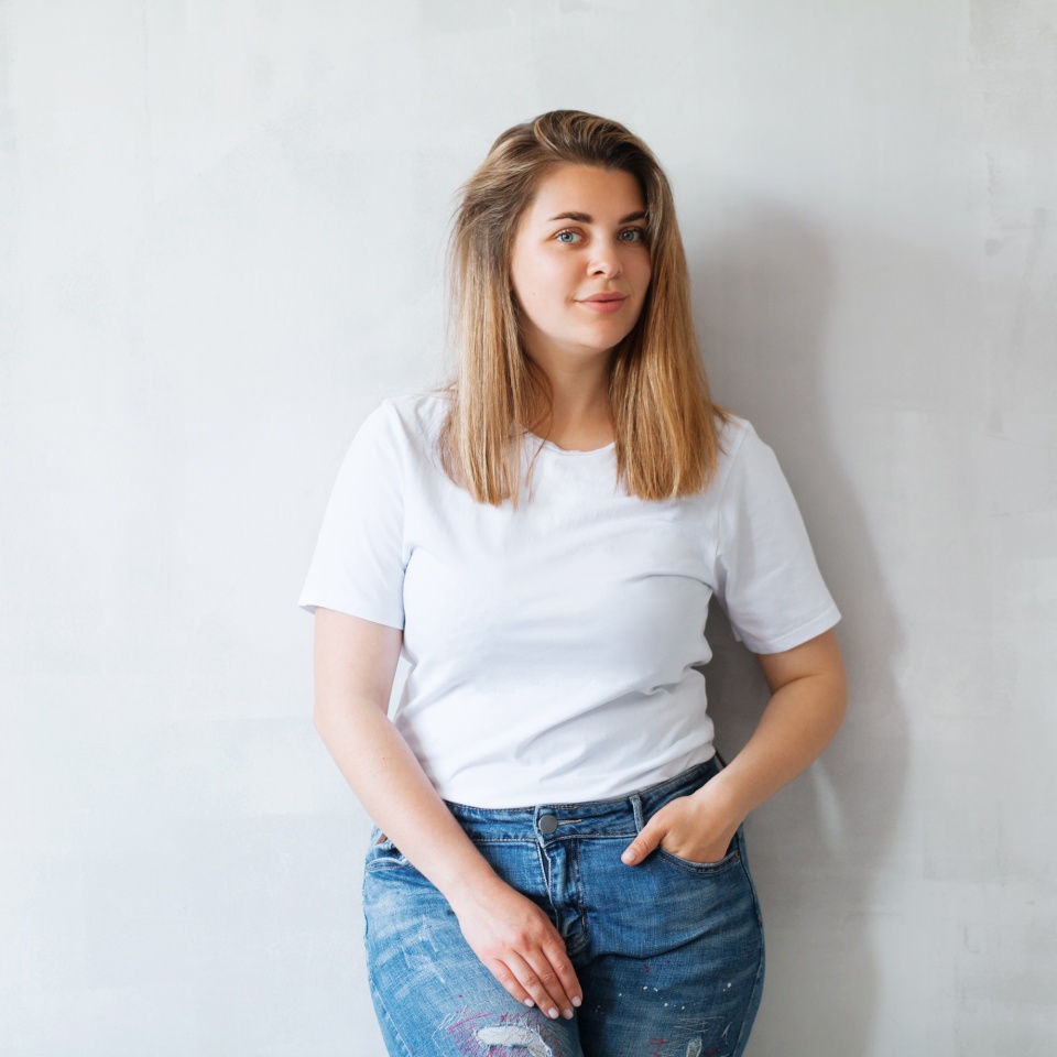 Portrait of young beautiful woman in white t-shirt and jeans