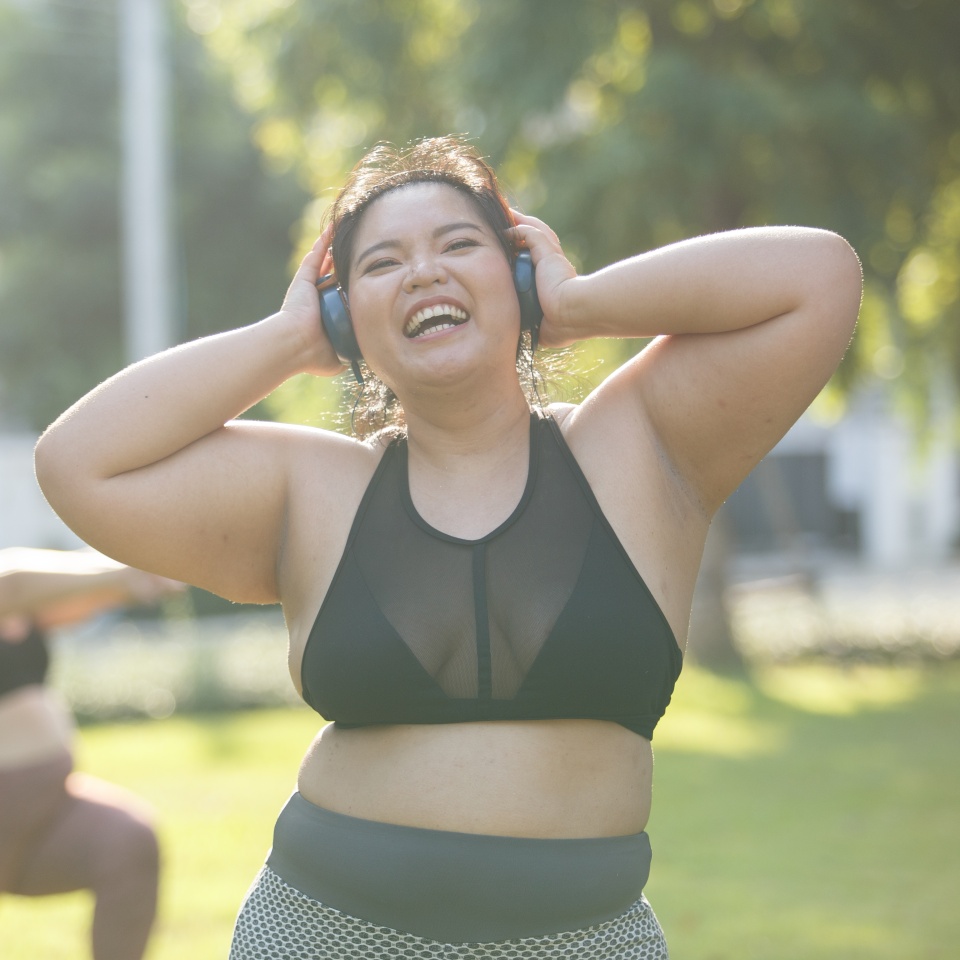 Asian female overweight in sportswear and headphone aerobic exercise physical activity. women plus size aerobic dance fitness lifestyle. concept of healthy.