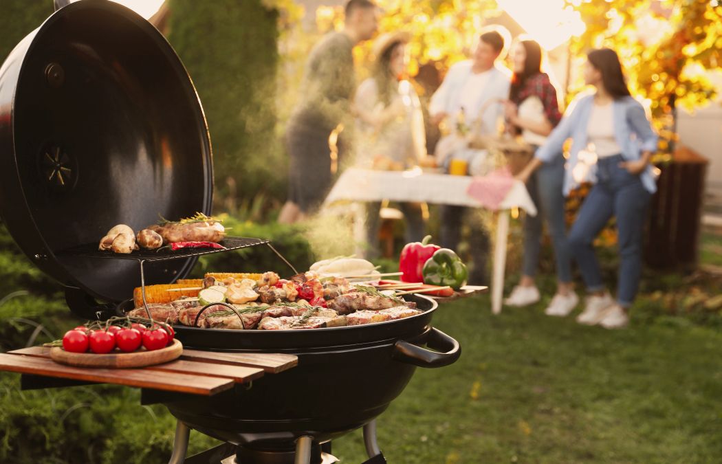 Group of people having a garden BBQs party