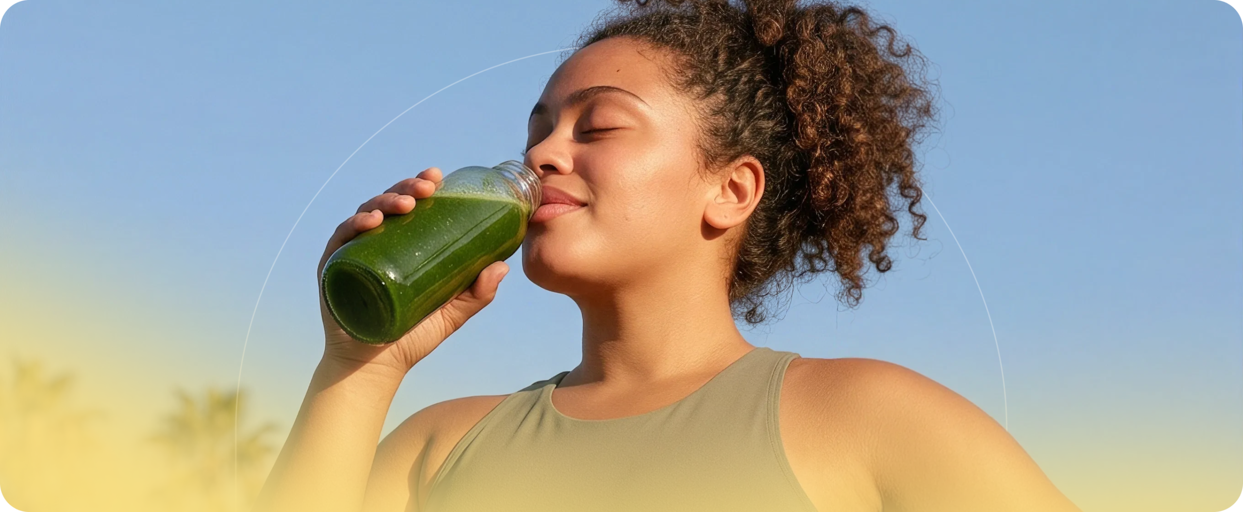 Hello Dose member drinking a green juice